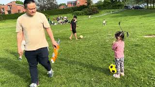 Cute baby baby having fun with her new friend at the park