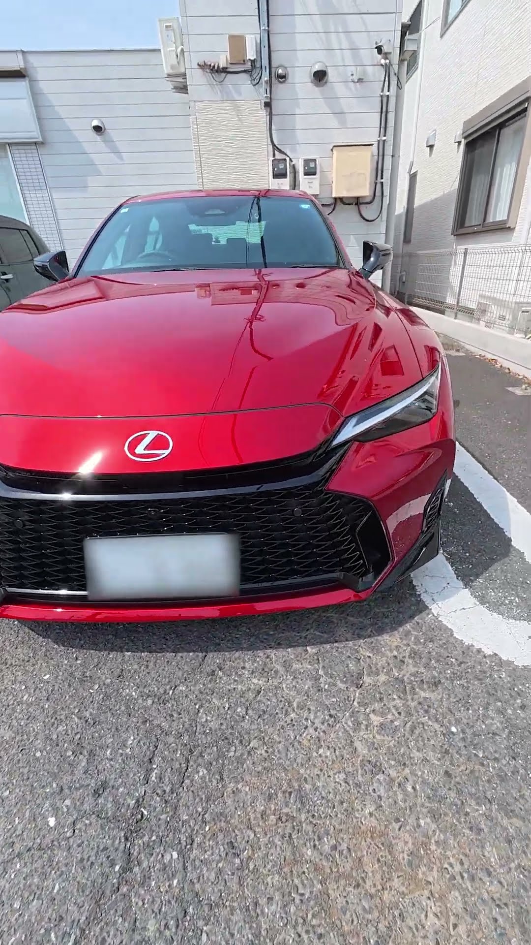 The new Lexus IS, with its newly designed wheels and Radiant Red
