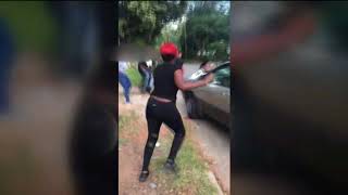 SUV runs through women involved in street brawl