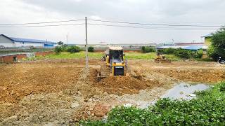 Area Development Work by Bulldozer SHANTUI DH17 and Dump Trucks Filling Pond