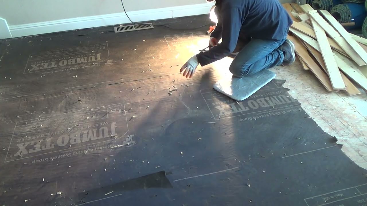 Condo Reno in Progress How to Remove Floor Planking Removing the Staples
