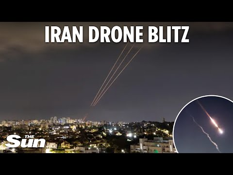 Israel blasts 300 missiles and drones out of sky after Iran launches massive barrage as sirens wail.