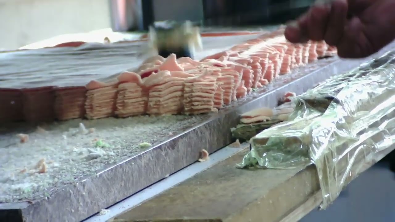 Precision die cutting press shaping plush toy fabric panels in production