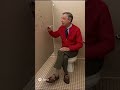 Mr. Rogers shows bathroom stall art with kindness