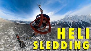 FLYING SNOWMOBILES TO ALPINE PARADISE WITH A HELICOPTER