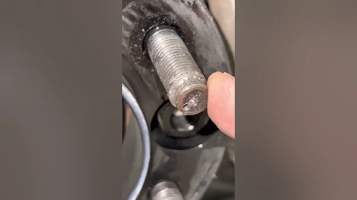 Removing a wheel nut from a spinning stud