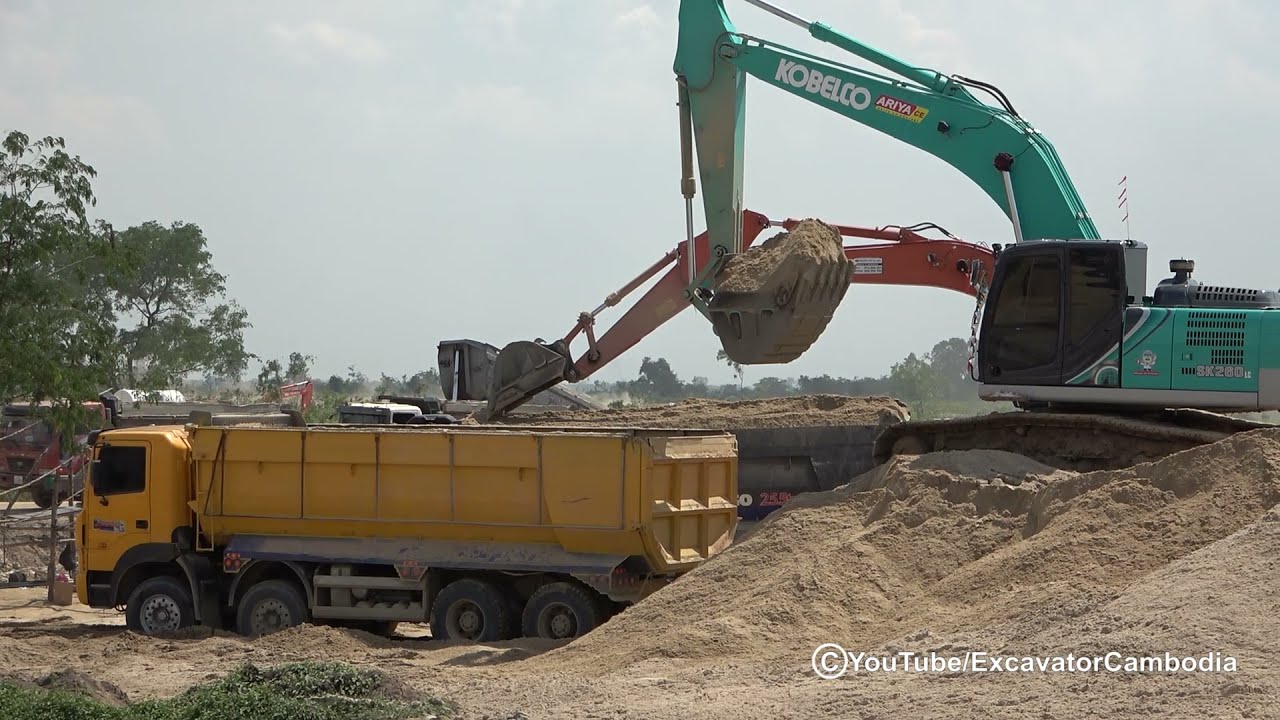Amazing Extreme KOBELCO SK260LC Excavator loading Sand Into Dump Trucks
