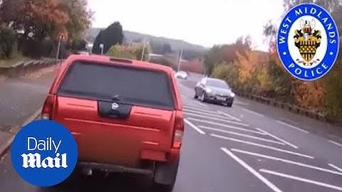 Driver brake checks cyclist and tries to run him off the road