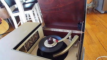 V-M record player playing a stack of 45 RPM records