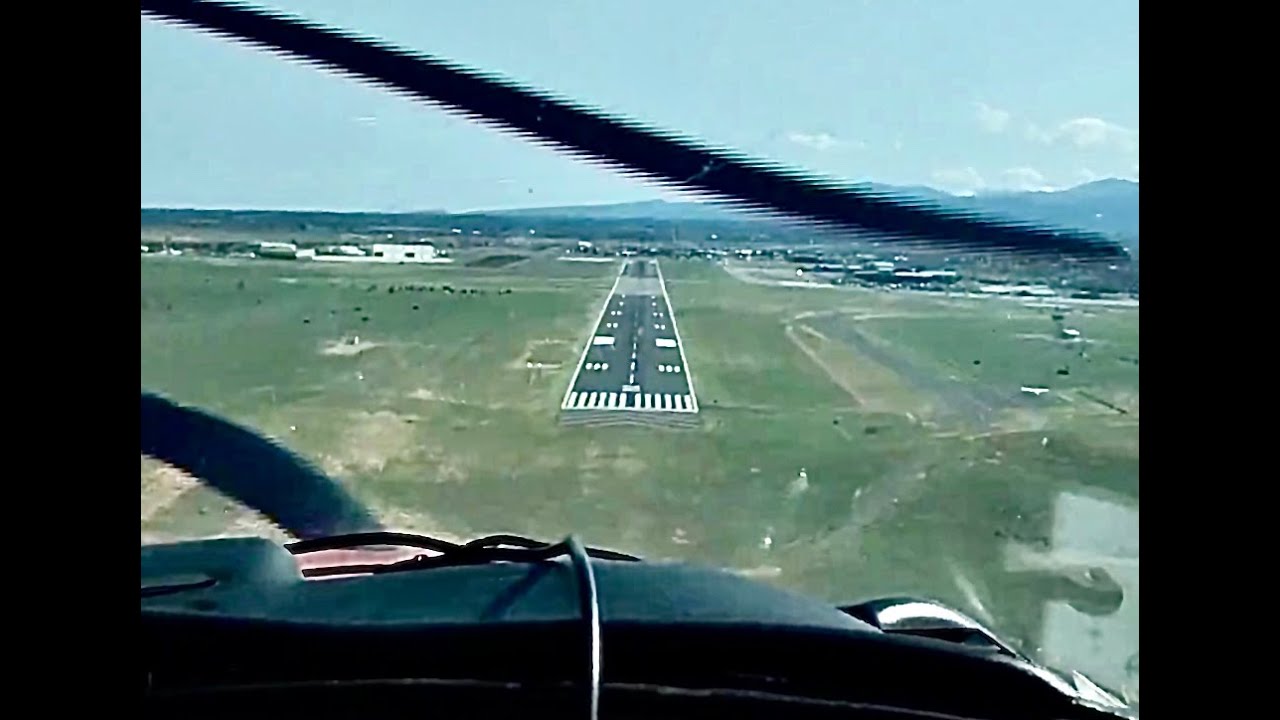 Single prop airplane landing Santa Fe Regional Airport, New Mexico