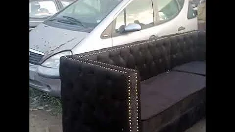 L shaped tufted sofa