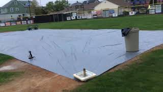 Harbor Freight 28x59 foot silver tarp covering Little League infield