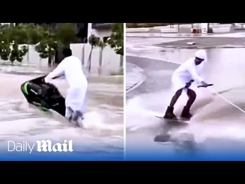 Thrill seeking Emiratis on jet skis swerve through Dubai's flooded roads after heavy rains sink cars