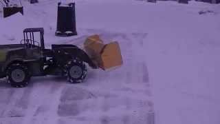 1/5 scale RC loader pushing snow