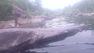 Blue Hole Ocoee 2026 -- showing Nikita the tunnel under the tilted rock