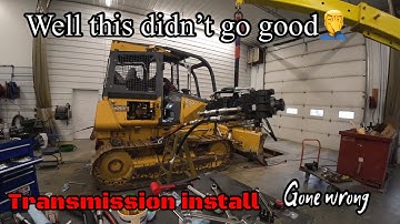 Back installing transmission pumps on Deere 650J dozer after one busted, but we had an epic fail
