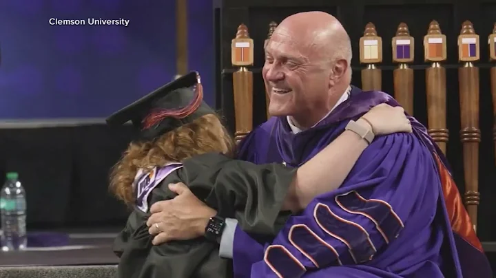 Clemson University president gets bear hug from daughter when presenting her with her degree | GMA