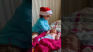 Cute Girl Meeting Newborn Brother