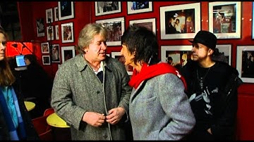 Ronnie Wood talking with Mick and Dick Taylor