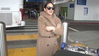 Adria Arjona Of Underground 6 Bundles Up At LAX