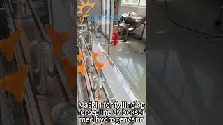Pakkelinje for hydrogenrikt vann, inkludert fylling, forsegling av bokser og etikettering