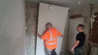 Dot and dab plasterboard on brick wall