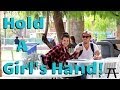 Interesting way of holding a girl’s hand
