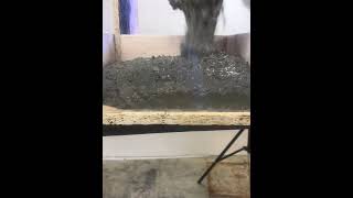 Lightweight concrete flooring underlayment pour viewed through plexiglass