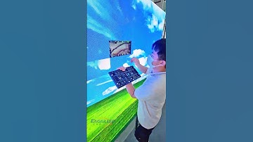 Technician maintains LED screen at computer desktop. #leddisplay #eagerled #ledvideowall
