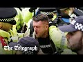 Police bundle Tommy Robinson out of the antisemitic London march as he&#39;s &#39;not welcome&#39;