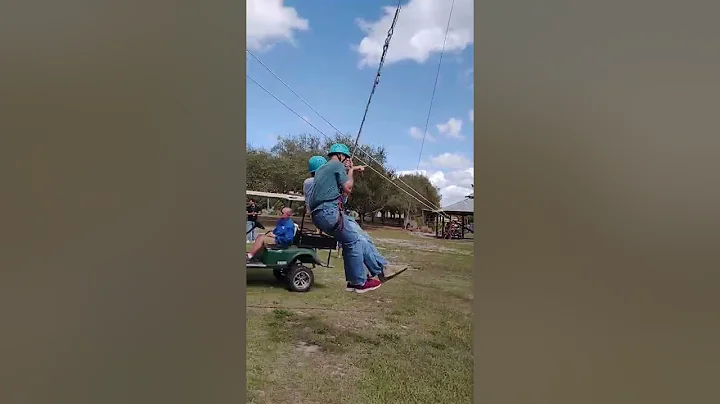 Ken groff and Leslie Smith from legacy Christian Church enjoying 40 ft rope swing at men's retreat