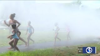 VIDEO: Families cool off with a run through an open fire hydrant in Middletown