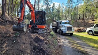 Stumping scooping and truckin with the Kubota KX040 the fun job