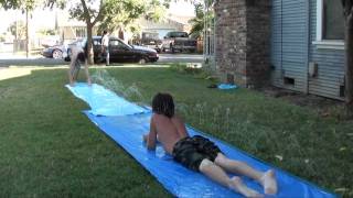 Crazy Kids, Teens On A Slip And Slide