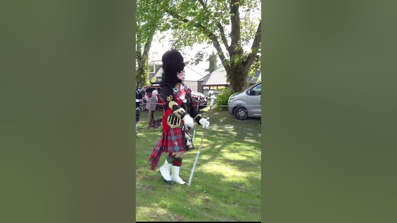 Drum Majors lead the Massed Pipes and Drums Parade at 2022 Oldmeldrum