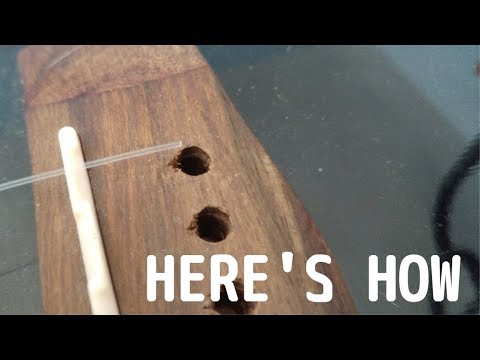 How to put nylon strings on acoustic guitar?