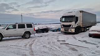 Jeep on Ice Helps Pulling Truck / Commander