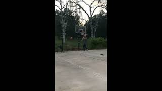 Guy picks up kid to dunk basketball and kid hits head on rim