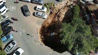 Israeli police inspect sinkhole in Jerusalem parking lot | AFP