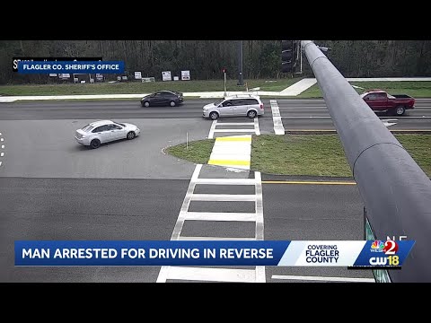 Video: Man arrested for driving backward on Flagler County road