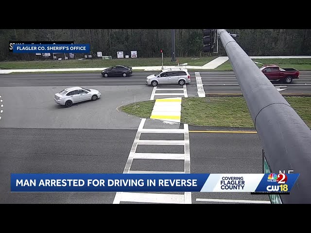 Video: Man arrested for driving backward on Flagler County road