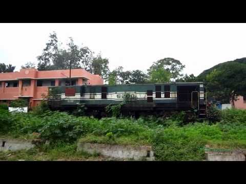 The video starts with Tuticorin Mysore Express led by ED WDM-2 gliding through Nayandahalli.. Then WDM-2 shows its true power as we blast through Hejjala.. Then we move out of Ramanagaram and cross Arkavati river.. The double track ends here.. Then we slow down as we approach Channapatna..... After departing from Channapatna we cruise through the fields.. the doubling work done till now can be seen... We slow down as we enter Mandya Station.... Again we zoom through greenery after departing from Mandya and also pass Yeliyur station... Then we pass Loka pavani Bridge.... Then we enter the beautiful Srirangapatna.. we cross both the Kaveri bridge as well.... we finally enter Mysore outer and pass goods yard.. then we meet the Hassan Mysore line... Then we pass the poor YDM-4 getting eaten by overgrowth.. Then we see the MG coaches being broken down as the train enters the platform of Mysore Junction... Date: 02/10/10 Location: Between Bangalore and Mysore Camera : Canon IXUS 120 IS