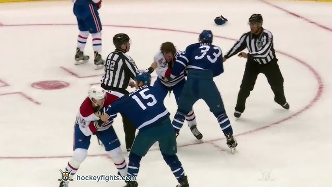 January 01, 2017: Toronto Maple Leafs left wing Matt Martin (15) fights  Detroit Red Wings center Steve Ott (29) along the benches during the 2017  Scotiabank NHL Centennial Classic between The Toronto