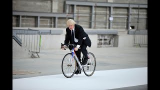 Former UK Prime Minister Boris Johnson rides bicycle to Supermarket