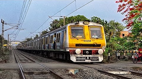 Amazing Aerodynamic Speedy Advertise Printed Colourful EMU Train Skip between Railgate | ER