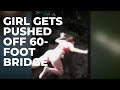 Girl gets pushed off 60-foot bridge