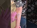 Stencil placement for a tiny peony bouquet tattoo  bunami ink