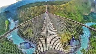 Riding on Kushma Gyadi Bridge, the Tallest and Highest Suspension Bridge in Nepal. Would you dare to ride on this hanging 