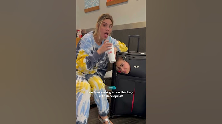 Lele Pons walking around with Greeicy... inside a bag?