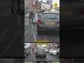 Police dashcam shows stolen car racing through red lights and around an ambulance in Manchester c...